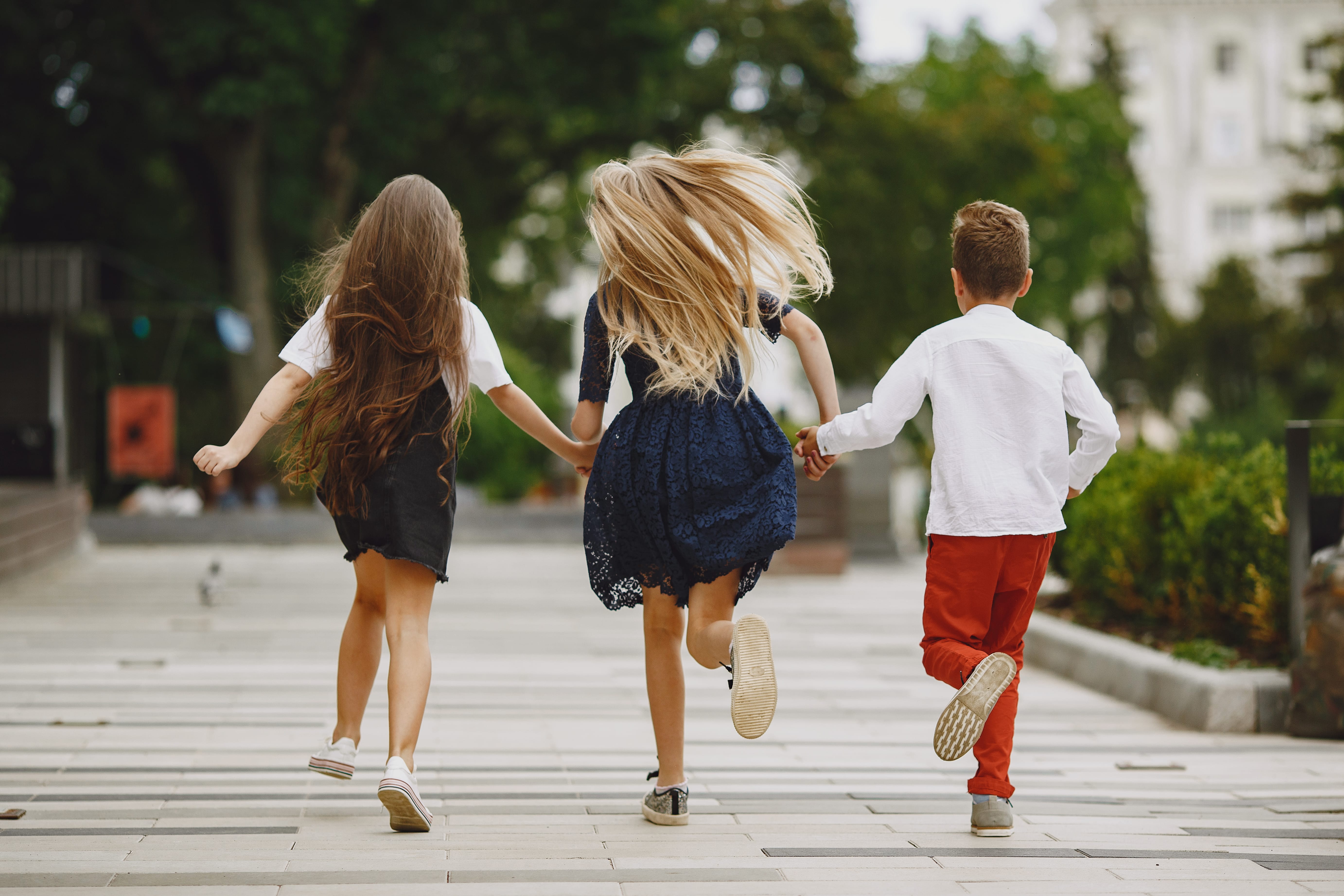 Happy children spend time together in a summer city